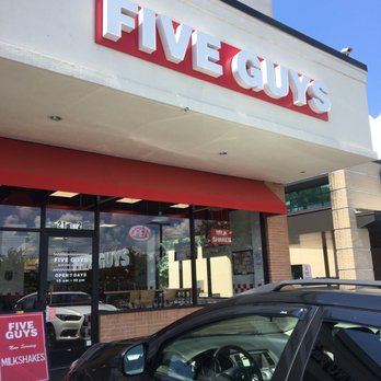 Five Guys - a car parked in front of a five guys restaurant - Burgers Near Me - Nashville, Tennessee