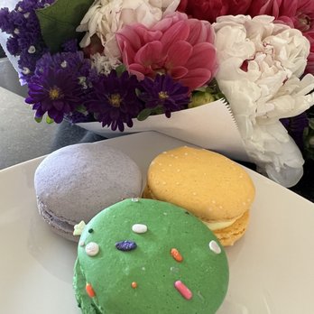 Lady Yum - Denny Triangle - Watermelon, honey lavender, and pina colada macarons (with the leaking bouquet in the background). - Macarons Near Me - Seattle, Washington Lady Yum - Denny Triangle - Watermelon, honey lavender, and pina colada macarons (with the leaking bouquet in the background). - Macarons Near Me - Seattle, Washington