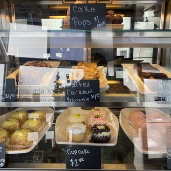 The Rustic Bluebird - a display of pastries - American Near Me - Almont, Michigan