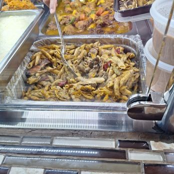 Kori’s Island & American Eats - a woman serving food - Caribbean Near Me - Bronx, New York