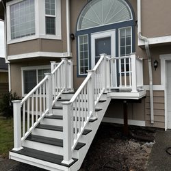 Bash Solutions - Photo 3 of 3
Front porch remodel completed -- posts replaced, structure reinforced, and new composite decking with railings installed.
