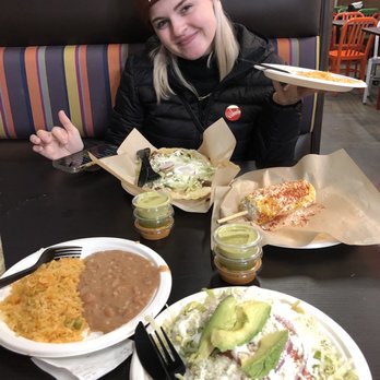 Taqueria Los Ocampo - a woman sitting at a table with plates of food - Mexican Near Me - Minneapolis, Minnesota Taqueria Los Ocampo - a woman sitting at a table with plates of food - Mexican Near Me - Minneapolis, Minnesota