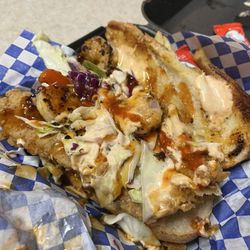 Chicken and Waffles For The People - Rich boy. Fried catfish po boy topped with jerk grilled shrimp.!