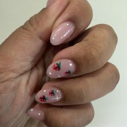 Gel X manicure, blush pink with strawberries, white dots and small star details