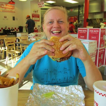 Five Guys - Scruffy person eating scruffy burger - Burgers Near Me - North Dartmouth, Massachusetts Five Guys - Scruffy person eating scruffy burger - Burgers Near Me - North Dartmouth, Massachusetts