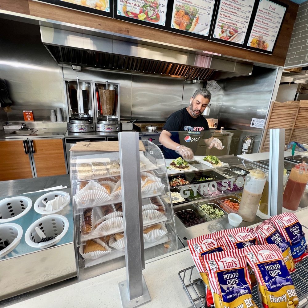 Gyro stop - a man preparing food in a kitchen - Mediterranean Near Me - Monroe, Washington Gyro stop - a man preparing food in a kitchen - Mediterranean Near Me - Monroe, Washington