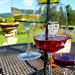 two glasses of wine on a table two glasses of wine on a table