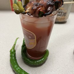 Mossy Ledge Spirits - ...cornichon pickles and bacon wrapped hot peppers