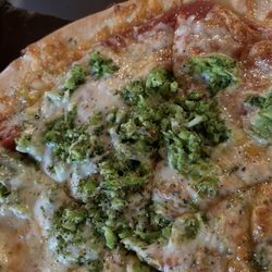 Pizza Barn - Pizza with some broccoli.