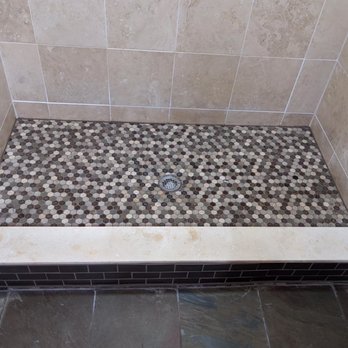 Advantage Tile & Grout - Finished job. Replaced all tile on shower floor and bottom of shower wall. Installed new stone ledge and tile work on sides of ledge. - Tiling Near Me - Highlands Ranch, Colorado
