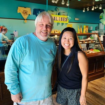 Pecan Jacks 30A - a man and a woman standing in front of a bakery - Ice Cream & Frozen Yogurt Near Me - Santa Rosa Beach, Florida Pecan Jacks 30A - a man and a woman standing in front of a bakery - Ice Cream & Frozen Yogurt Near Me - Santa Rosa Beach, Florida