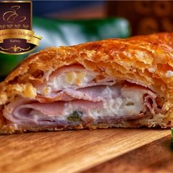 Colombian Delights Bakery - Ham, Cream Cheese, & Jalapeno puff pastry. Available for preorder only.