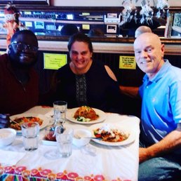 My husband, myself and my dad enjoying dinner the other night.  Photo taken by Jimmy, the owner.