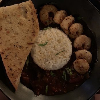 The Lost Cove - Shrimp and sweet & spicy stewed tomatoes over rice. - Beer Bar Near Me - Baton Rouge, Louisiana