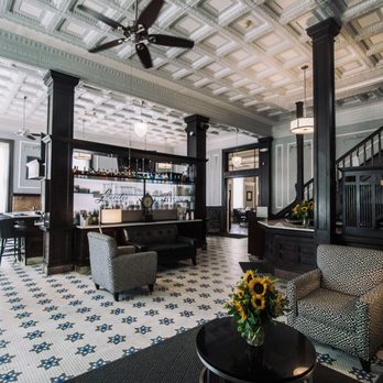 The Continental Hotel - The welcoming lobby of The Continental Hotel is also home to our in-house restaurant and bar, Lucile's. - Hotels Near Me - Centerville, Iowa The Continental Hotel - The welcoming lobby of The Continental Hotel is also home to our in-house restaurant and bar, Lucile's. - Hotels Near Me - Centerville, Iowa