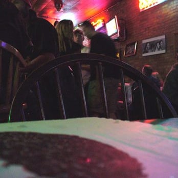 Paramount Bar - a group of people sitting at a table - Bars Near Me - Salina, Kansas