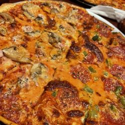 Roberto's Italian Restaurant - Yummy pizza featuring Provel Cheese