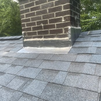 Scott Plante Construction - a chimney on a roof - Roofing Near Me - Epping, New Hampshire
