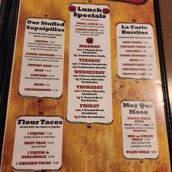 Casa De Benavidez - Menu 3/2/23 - Menu from Casa De Benavidez in Albuquerque displays lunch specials, stuffed sopaipillas, burritos, flour tacos, and Que Moso stews. The menu includes details on daily lunch specials with specific dishes like chicken, beef, and enchiladas, along with prices. The design features a rustic background with decorative borders and headings for different food categories. - Mexican Near Me - Albuquerque, New Mexico