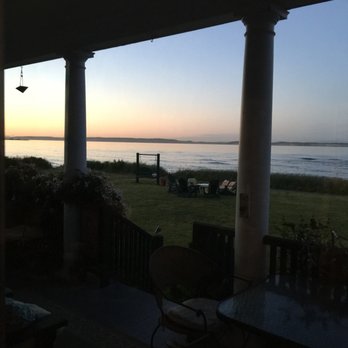 Commander's Beach House - Looking out from the porch in the evening - Hotels Near Me - Port Townsend, Washington Commander's Beach House - Looking out from the porch in the evening - Hotels Near Me - Port Townsend, Washington