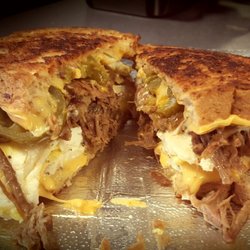 Too-N-Fro Cafe - Game changer!! Loaded breakfast sandwich on multigrain toast.