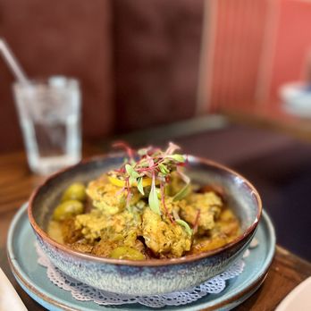 Baboush - a bowl of food on a table - Moroccan Near Me - Dallas, Texas Baboush - a bowl of food on a table - Moroccan Near Me - Dallas, Texas