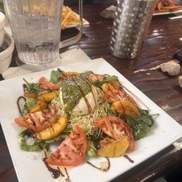 Grilled peach and burrata cheese salad.