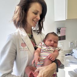 Dr. Broad holding my miracle baby Dr. Broad holding my miracle baby