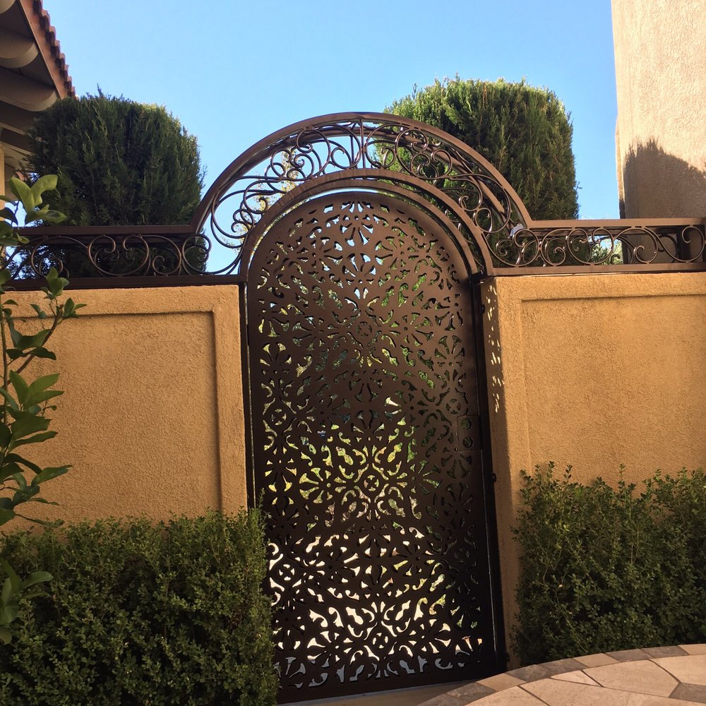 Custom two pane plasma cut gate and wrought iron arbor. Custom two pane plasma cut gate and wrought iron arbor.