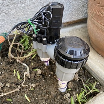 EZ Handyman and Plumbing Services - a water pump in the ground - Plumbing Near Me
