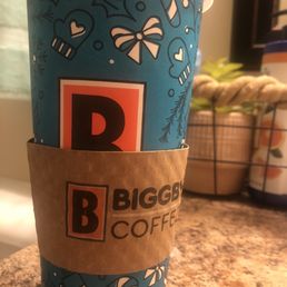 a cup of coffee on a counter a cup of coffee on a counter