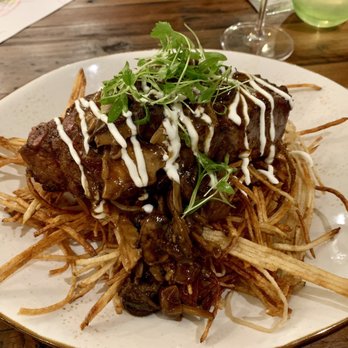 Trillium - New York strip on a bed of potato string fries covered in a yummy mushroom sauce. Out of this world! - New American Near Me - Boise, Idaho Trillium - New York strip on a bed of potato string fries covered in a yummy mushroom sauce. Out of this world! - New American Near Me - Boise, Idaho