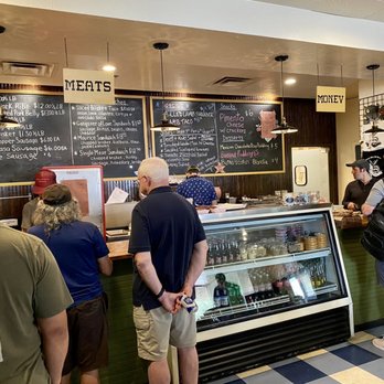 Interstellar BBQ - The counter: meats, sides, money/merch on wall (April 2022) - Barbeque Near Me - Austin, Texas Interstellar BBQ - The counter: meats, sides, money/merch on wall (April 2022) - Barbeque Near Me - Austin, Texas