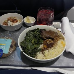Delta Air Lines - First class meal.  Short rib, rice, greens & Burrata.