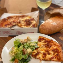 Pepperoni pizza, caesar salad, and a loaf of their fresh baked bread. Curbside Take-Out. Pepperoni pizza, caesar salad, and a loaf of their fresh baked bread. Curbside Take-Out.