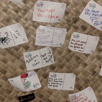 Eastern Palace Club - a wall covered in sticky notes - Tiki Bars Near Me - Hazel Park, Michigan