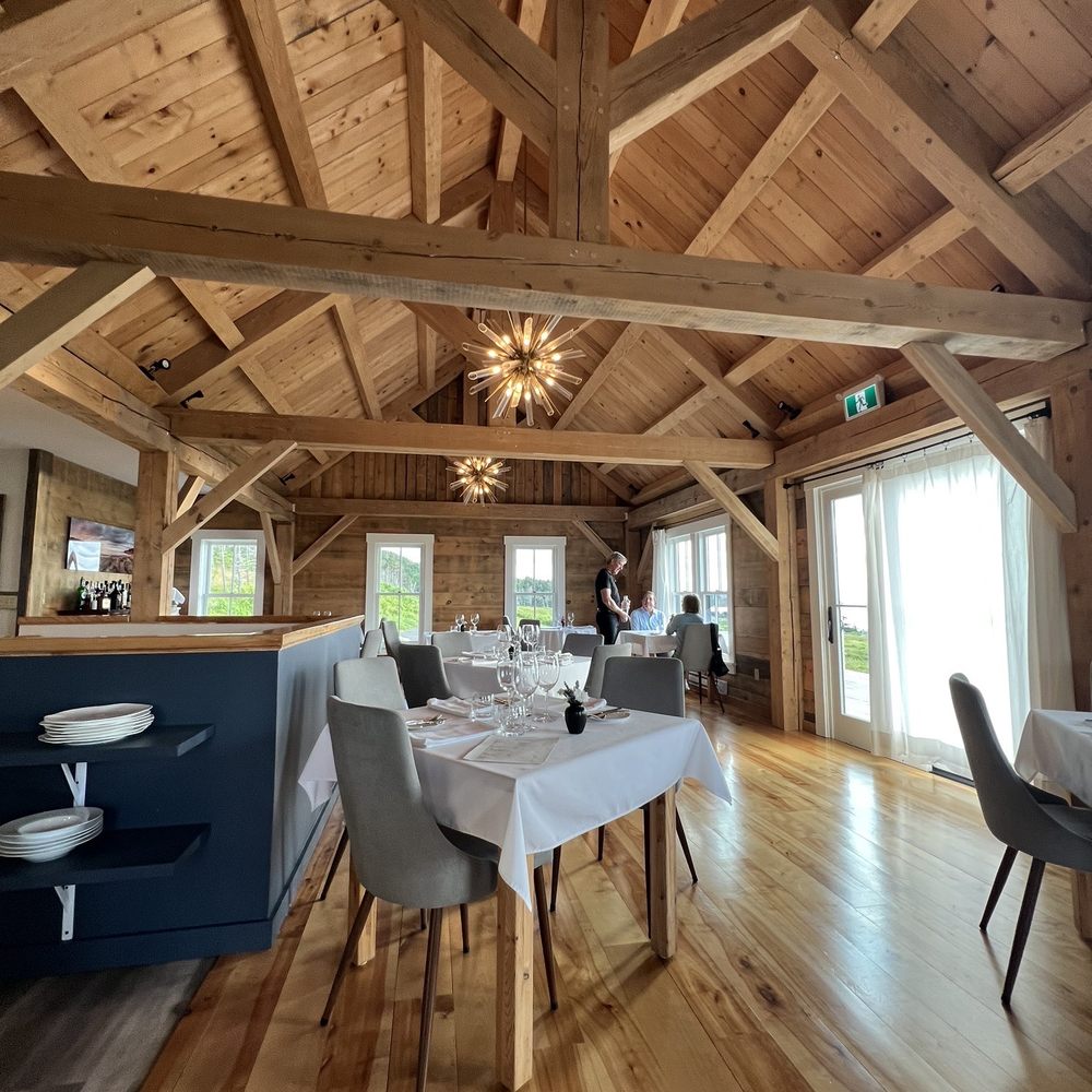 Woodroad - a dining room with a table and chairs - Seafood Near Me - Margaree Harbour, Nova Scotia Woodroad - a dining room with a table and chairs - Seafood Near Me - Margaree Harbour, Nova Scotia