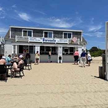 Barnacle Snack Bar - people sitting at tables on the beach - Burgers Near Me - Centerville, Massachusetts