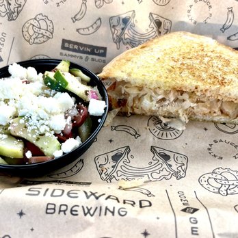 Sideward Brewing Co - Tempeh Reuben with cucumber salad side - Breweries Near Me - Orlando, Florida Sideward Brewing Co - Tempeh Reuben with cucumber salad side - Breweries Near Me - Orlando, Florida