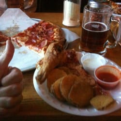 Papa Guido’s Pizza - Greatest combo... pizza, chicken, mojos, and beer! f*ck yeah!