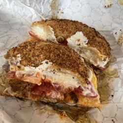 Grandpa's Bagels - Chorizo, egg, and cheese with a slice of tomato and plain cream cheese on a garlic, an onion bagel lightly toasted. Very good bagels!