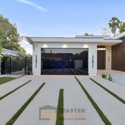 Master Garage Door Orange County - Black Anodized Finish Frame with
3/16" Black Opaque Tempered Glass frameless garage door installed in tarzana CA