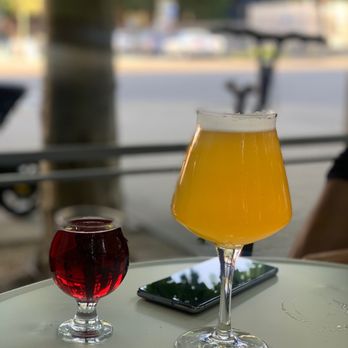 TeKu Tavern + Cafe - two glasses of beer on a table - Beer Bar Near Me - Seattle, Washington