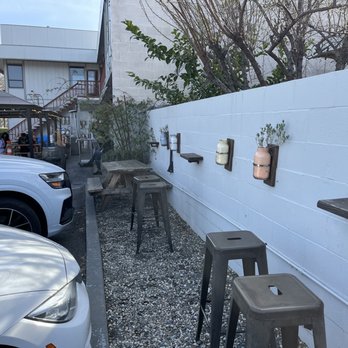 Rooted Coffee - More outdoor bar seats in front of parking spots - Coffee & Tea Near Me - Pleasant Hill, California Rooted Coffee - More outdoor bar seats in front of parking spots - Coffee & Tea Near Me - Pleasant Hill, California