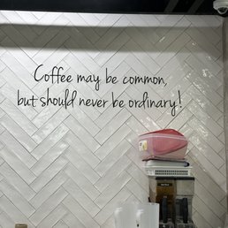 a kitchen with a coffee maker a kitchen with a coffee maker