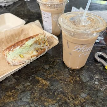 Haute Coffee - Pistachio croissant with iced salted praline coffee and tiramisu coffee - Coffee & Tea Near Me - Elk Grove, California