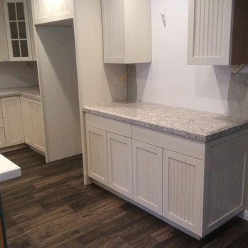 CB Flooring - a kitchen with white cabinets and wood floors - Flooring Near Me - Oxnard, California CB Flooring - a kitchen with white cabinets and wood floors - Flooring Near Me - Oxnard, California