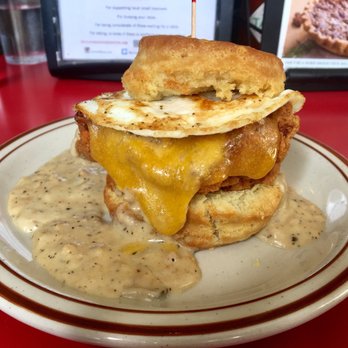 Pine State Biscuits - Reggie Deluxe - fried chicken, bacon, cheese topped with gravy + an egg. - Breakfast & Brunch Near Me - Portland, Oregon