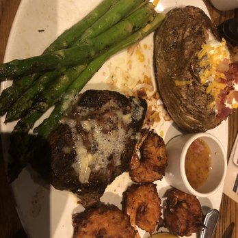 Outback Steakhouse - 6oz sirloin wth coconut shrimp, loaded baked potato and asparagus. Garlic butter topping on steak. - Steakhouses Near Me - Orlando, Florida Outback Steakhouse - 6oz sirloin wth coconut shrimp, loaded baked potato and asparagus. Garlic butter topping on steak. - Steakhouses Near Me - Orlando, Florida
