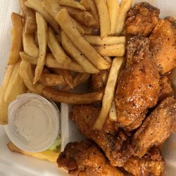 Wing It - Hot garlic wings and fries (fried hard)